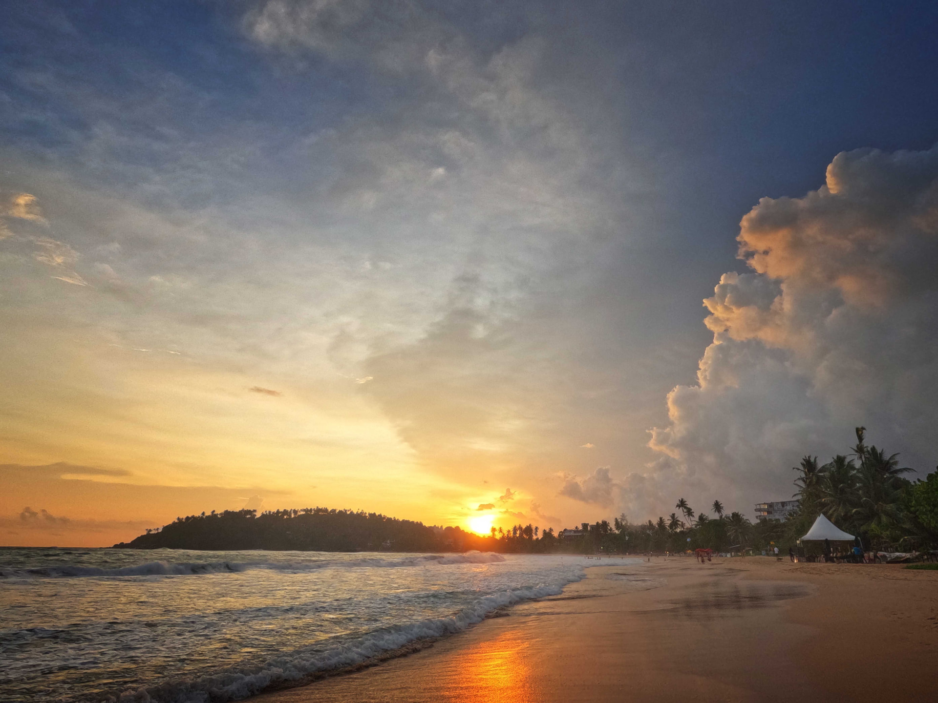 Palm-fringed beach and turquoise water at Mirissa, southern Sri Lanka